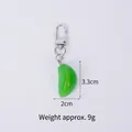 Groene knoflookteentje sleutelhanger van PVC met zilveren karabijnsluiting en 9g gewicht - Groene knoflookteen - Kreeftsluiting