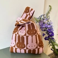Cute knitted Japanese knot bag with pink rabbit checkerboard pattern and unique wrist strap - Pink Rabbit