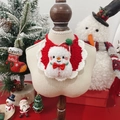 Detail of handmade crochet pet bib with Christmas snowman design and red bow decoration - One Size / Snowman
