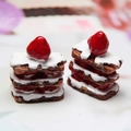 Close-up of miniature resin strawberry napoleon cakes with realistic layered details - Dark Coffee