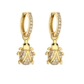 Detailed view of ladybug charm earrings with gold finish and sparkling zircon stones - Gold White Zircon Beetle