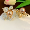 Golden bow stud earrings with champagne pearl and pear-cut zircon pendants - E6903 Silver Pin-Gold
