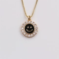 Detail of gold-plated smiley pendant with black enamel and sparkling zircon border - Black