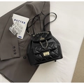 Chic black quilted backpack with dual gold twist locks and elegant chain handle - Small / Black