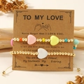 Handmade beaded friendship bracelets with heart charms on card in warm scene - Warm Pink Yellow Heart Set (JS-S24110506A-P)