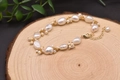 Baroque natural pearl bracelet with 18k gold plated wire on rustic wood background - Baroque Freshwater Pearl Bracelet