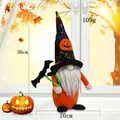Halloween gnome plush with black wizard hat and bat accessory in autumn setting - Bat Style