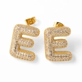 Golden letter E stud earrings with micro-paved zircons and polished finish - Letter E