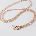 Detail of champagne crystal beads and white pearls on a multifunctional glasses chain - Transparent Champagne