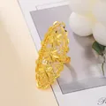 Macro detail of Dubai style gold plated hollow flower ring with brushed metal texture - Triple Flower Brushed Hollow Style