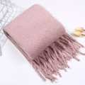 Soft pink mohair-style knit scarf with fringe tassels on a minimalist background - Pink