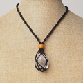 Handmade macrame net necklace with natural clear crystal stone on a mannequin display - Black Net Holder