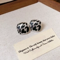 Close-up of square silver stud earrings with black spotted cow print pattern - Black Silver Spotted Square (Silver Earring Post)