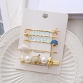 Set de pinzas para el cabello con estrellas de mar, conchas y perlas en tarjeta blanca - Set de Circonita Blanca