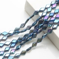 Close-up of iridescent diamond-shaped glass crystal beads for DIY jewelry making - Transparent Blue