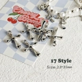 Close-up of liquid metal style cross pendant for Y2K DIY jewelry on a textured background - Style 17 Large Cross