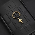 Detail of beaded ring featuring black faceted beads and a gold star-shaped charm - Black Bead Four-Pointed Star Style (F-R584)