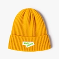 Bright yellow ribbed knit beanie featuring dual white labels with neon green text - Ginger Yellow