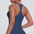 Detail of racerback design and elastic dark blue fabric on women's athletic tank top - S / Navy Blue