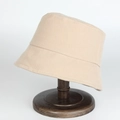 Classic khaki woven bucket hat for women with minimalist design and textured fabric - Adjustable / Beige