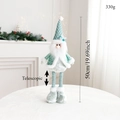 Details zur ausziehbaren Weihnachtsfigur mit Größenangaben vor festlichem Kaminhintergrund - Weihnachtsmann / Grüner Teleskop-Weihnachtsmann