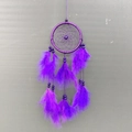 Handmade bohemian dream catcher with purple feathers and beads for home wall decoration - Hand-woven / Purple