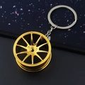Creative gold metallic car wheel hub keychain with detailed spoke design and glossy finish - 37mm Gold Wheel Rim