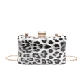 Detail shot of the black and white leopard print evening bag with sparkling diamond clasp - Black