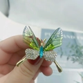 Elegant gold butterfly brooch with translucent green wings and sparkling rhinestones - Light Green Butterfly