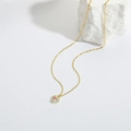Detailed macro of gold heart pendant with pink gemstone and light blue enamel work - Blue