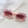Pink glitter kids oval sunglasses with wavy frame and model KD61097 on temple - Pink
