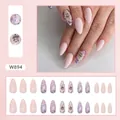 Almond press-on nails in nude pink with glitter accents and Little Angel letter designs - Colorful Glitter (W894)