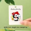 Cute panda enamel brooch with red flag and flower design on display card - Young Pioneer Salute Panda