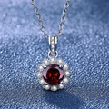 Silver necklace featuring a sunflower pendant with a round red zircon and white stones - Tz-19