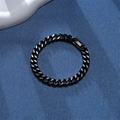 Close-up of black Cuban link bracelet with fold-over clasp on a blue textured surface - 2.5mm Width x 20cm Length / Black