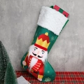 Groene satijnen kerstsok met notenkrakerprint en feestelijke witte rand van imitatiebont - Groene kerstsok