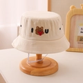 Detail of beige kids bucket hat featuring a teddy bear and IU letter embroidery - 54cm(3-10 Years) / Beige