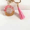 Pink resin letter O keychain with gold flakes, pink tassel and golden metal keyring - Letter O