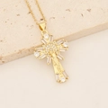 Detailed macro view of 18K gold plated cross pendant with cubic zirconia and Jesus figure - Jesus Figure Pave Zirconia Cross (10#)