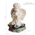 Estatua de ángel solar de resina con cruz luminosa y flores de colores en la base - Adorno de Ángel Arrodillado Solar