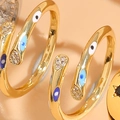 Verstellbarer goldener Ring mit blauem Auge-Motiv aus Emaille und Zirkonia Steinen - Emaille Böser Blick Stil (JZ0245)
