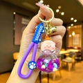 Porte-clés cochon rose dans bouteille pailletée violette avec sangle en silicone - Cochon Pêche Flocon de Neige Lumineux Violet
