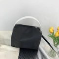 Minimalist black nylon handbag with white faux leather handles and top zipper closure - Black