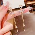 Elegant gold bow earrings with crystal zircon and long tassel chains for women - Gold Bowknot Zircon Tassel Earrings (Silver Earring Post) E1118