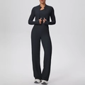 Detail of black athletic jacket with thumbhole cuffs and high-waisted yoga pants set - S / Black