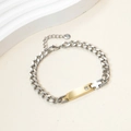 Cuban chain bracelet with golden nameplate, zircon stone, and cross on white background - 14k / Gold Curved Plate