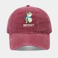 Detail of burgundy washed cotton baseball cap featuring green frog and RESIST embroidery - Adjustable / Burgundy