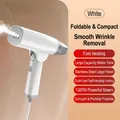 White 1300W portable handheld steamer with stainless steel plate in folded variant - EU Plug / White