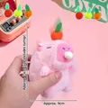 Pink Capybara plush keychain with carrot headband and squeaking feature, 15cm height - Capybara With A Radish On Its Head Squealing And Spitting Out Powder