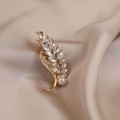 Elegant gold wheat ear brooch featuring sparkling crystals and a white round pearl detail - 560# Wheat Ear